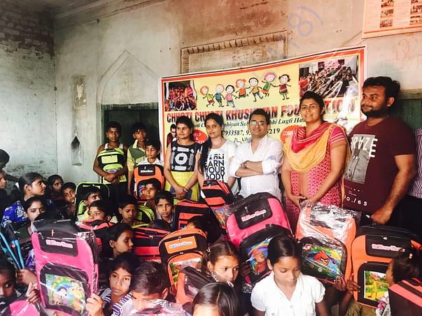 Bags distribution to the village kids to encoauge them to go to school