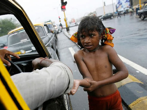 Poor children sleeping open on road join us in providing them clothes