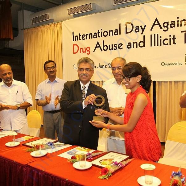 Anie receiving award from Justice Kamal Pasha