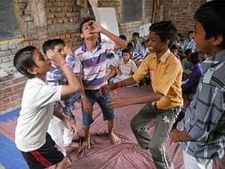Help teach 100 students of Urban slums