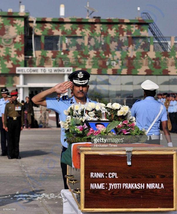 Senior Officer saluting the mortal remains