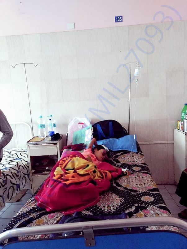 Dhanika in her bed at Dr. B. Borooah Cancer Institute