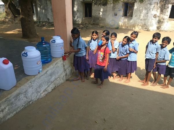 School kids with limited water cans