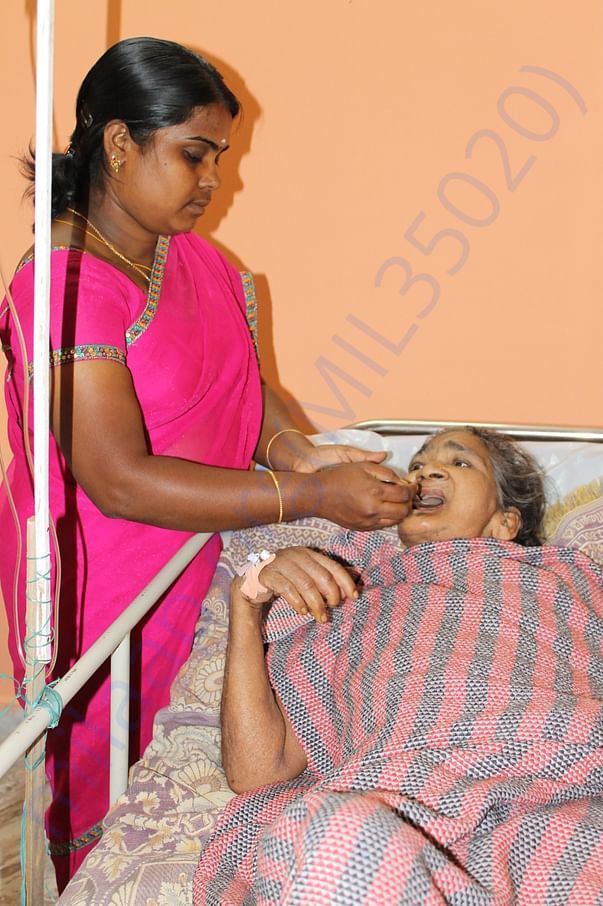 Spoon Feeding to inmate at our Destitute Welfare Center