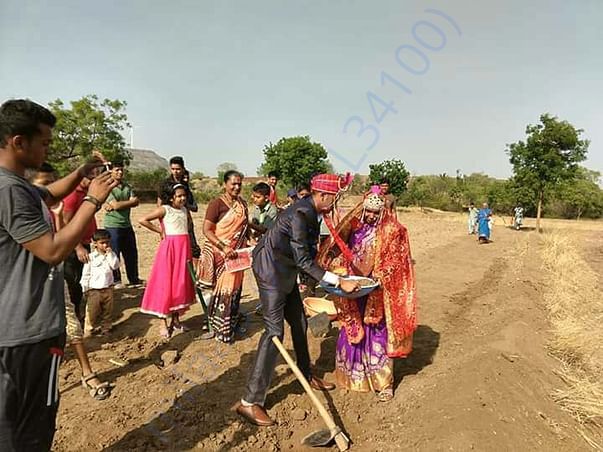Newly married couple working to save water