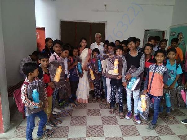 Pay Back To Society (Distribution of Bags And Bottles to Children's)