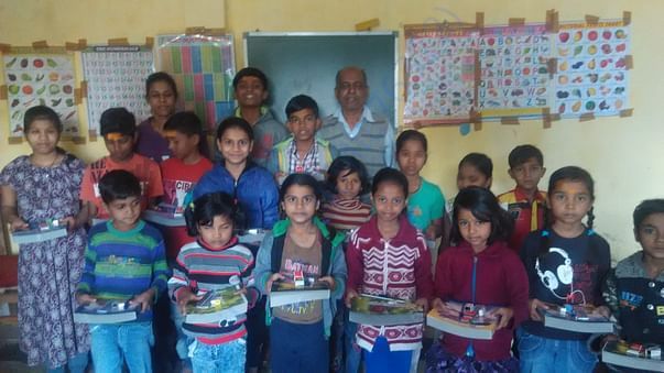 Pay Back To Society (Stationary items Distributed among children's)