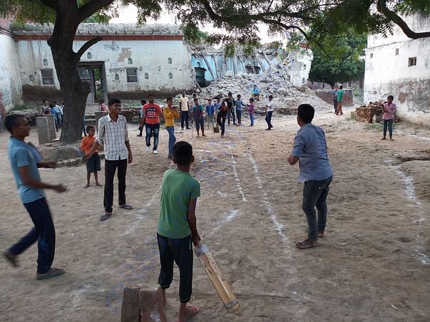 Boys team practicing and learning Cricket