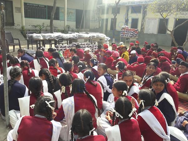 Provided 100 shoes and 100 school bags in govt. school in jagdev kalan