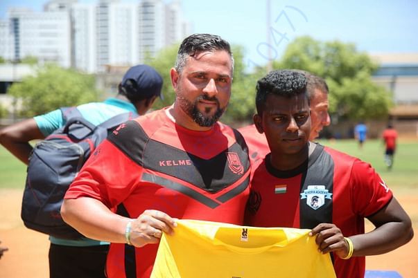 Player with the Spain Coach