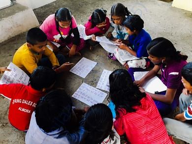 Children brainstorming solutions for water shortage in their village