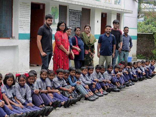 "NAVV SHIKSHA"Providing shoes,bag,story book,sweater etc to students