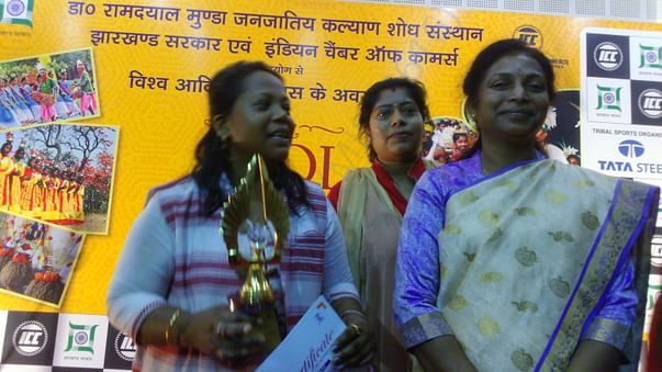 Aruna with Dr. Louis Marandi, Welfare Minister after winning 1st prize
