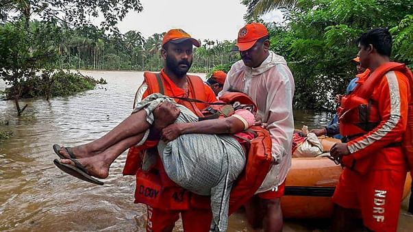 People washed ashore being rescued to camps
