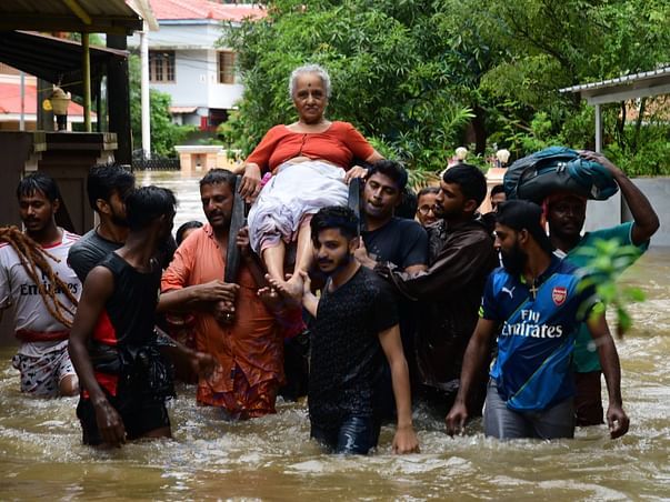An elderly woman is rescued following a flash flood