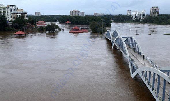 Houses are almost fully immersed in water