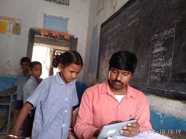 Volunteer conducting verbal early grade reading test