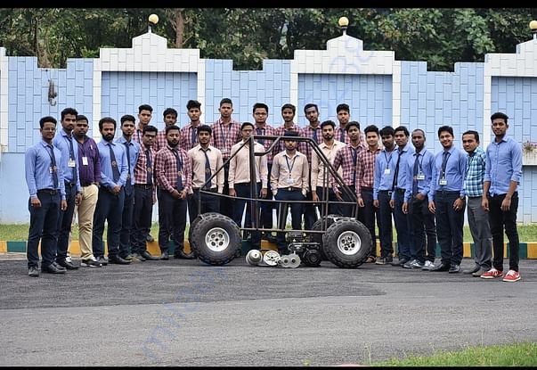 In picture showing rollcage with team members and faculty co-ordinator