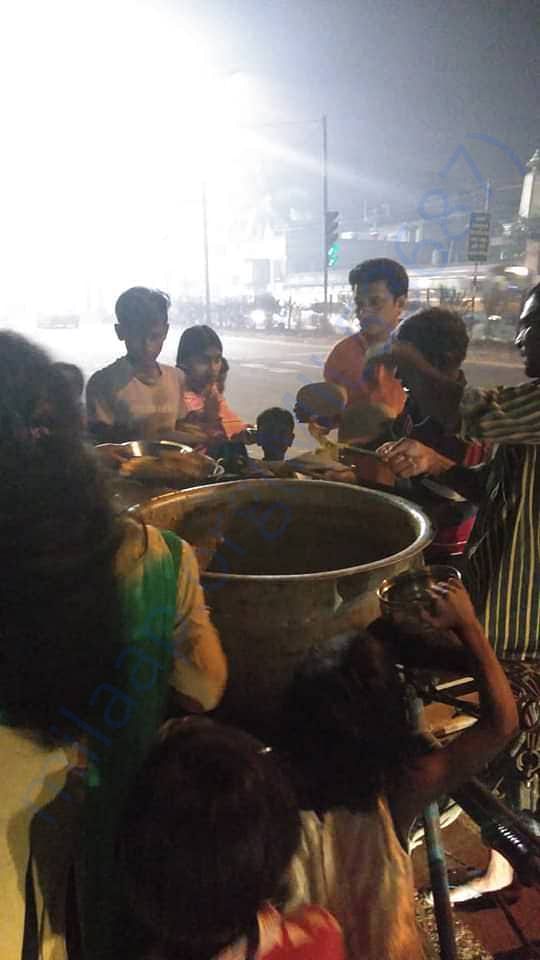 Indranil Banerjee feeding the street children of Dunlop