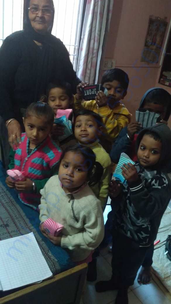 distributing pair of socks among the children