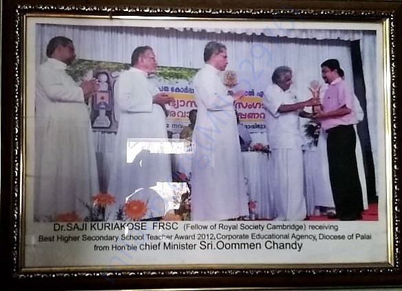 Saji receiving best Higher Secondary School Teacher Award