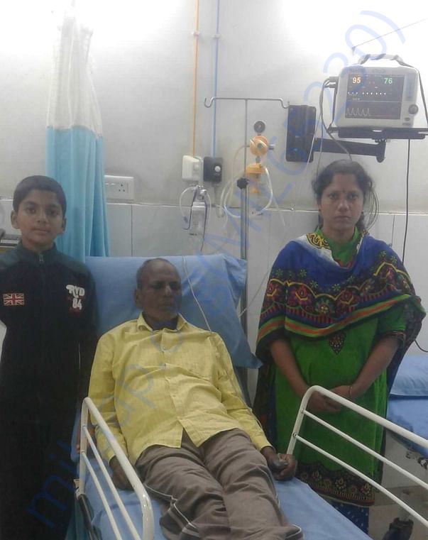With his kid and wife.