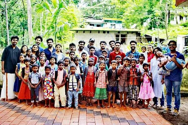 DISTRIBUTION OF SCHOOL KITS FOR TRIBAL CHILDREN AT THRISSUR