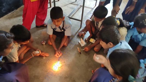 students doing experiments with aspiring mind