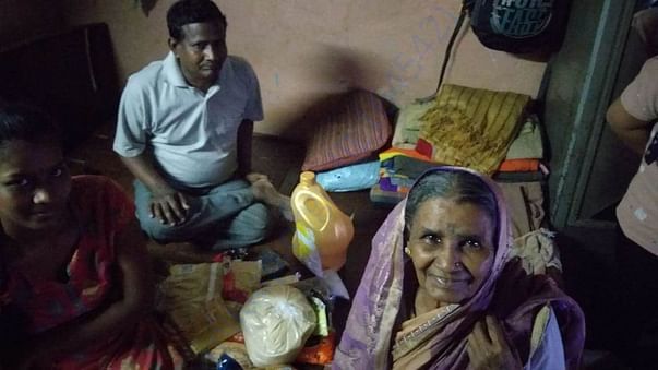 A poor family in Chembur recieves Ration packet through MIWF