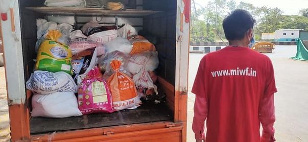 Volunteers in Mumbai ready to deliver food packets to the poor