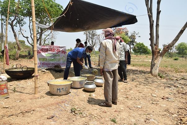 MANT volunteers preparing food for poor Santhali tribals