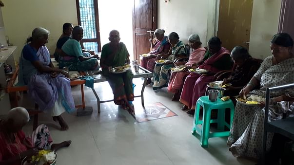 Oldagehome elderly women feeding by Charity Donations