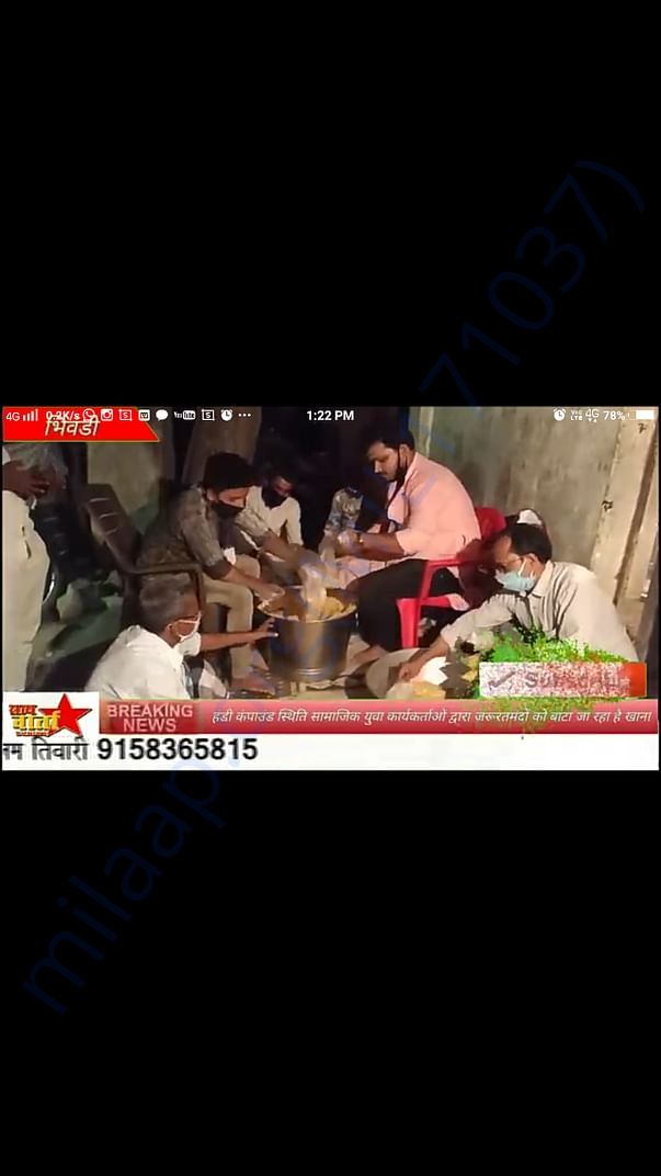 Local media coverage of our food distribution. (while packing)