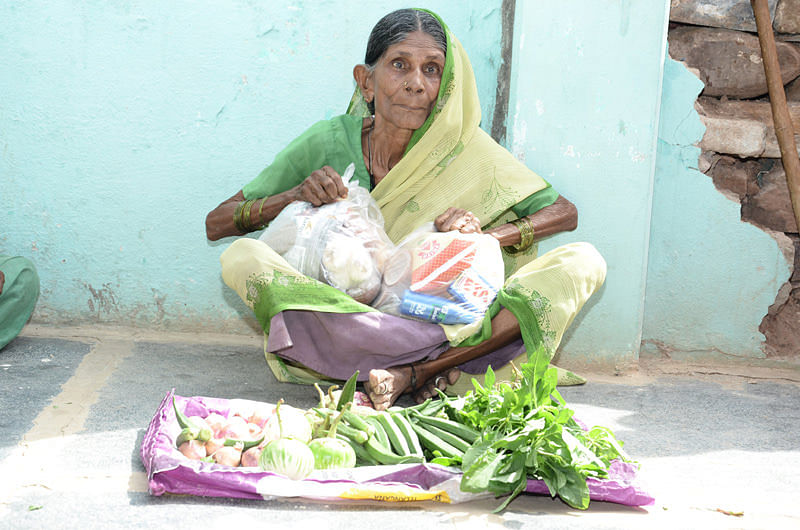 Oldage woman receiving food provisions adopt a granny