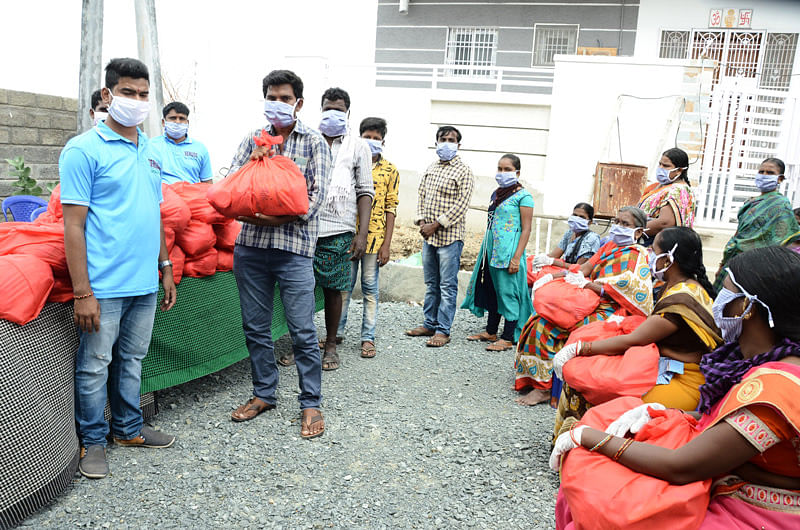 Migrant workers getting groceries kits donation from ngo Covid19