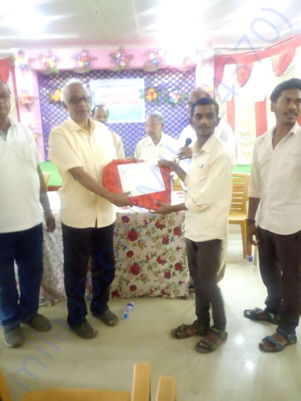 The sponsored youth is receiving recognition for excellent performance