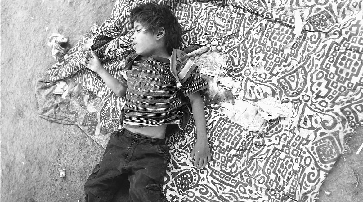 Sleeping kid on street