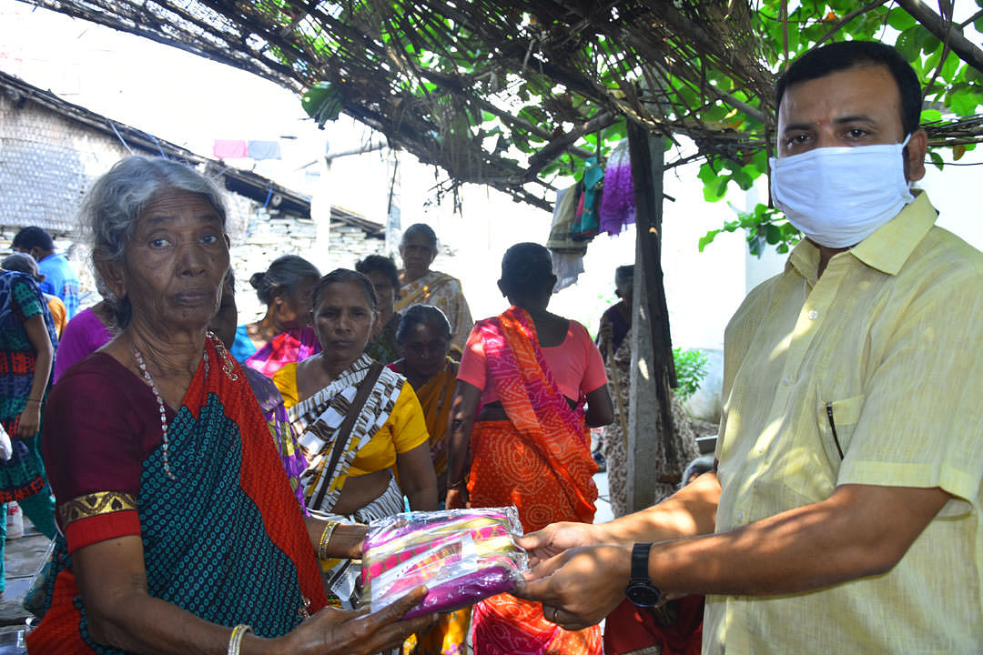 sponsorship of clothes to poor old age woman mid day meal care center
