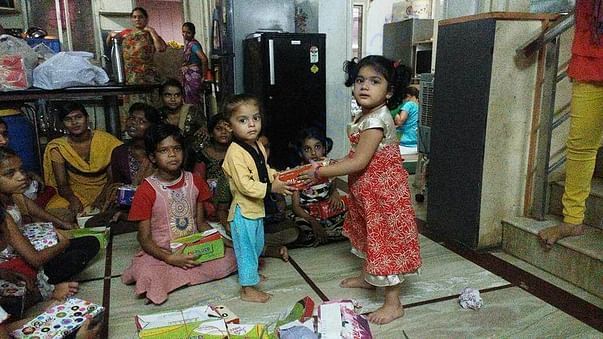 Our Field partners little kids donating footwear